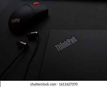 Kiev - July 20 2019: Lenovo Thinkpad X1 Tablet With Mouse And ThinkPad X1 In-Ear Headphones On The Black Table.