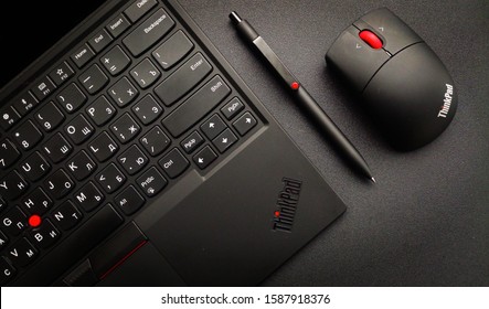 Kiev - July 29 2019: Lenovo Thinkpad X1 Tablet 3rd Gen With Computer Mouse On The Black Table. 