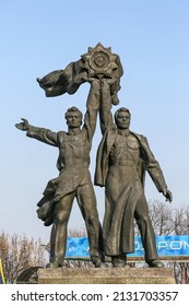 Kiev - October 27, 2013: Bronze Statue Of Russian And Ukrainian Worker Holding Up The Soviet Order Of Friendship Of Peoples.