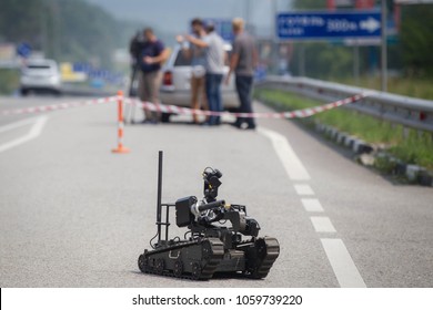KIEV REGION, UKRAINE - July 26, 2016: Robot of explosive technical service of National Police of Ukraine inspect the road after an anonymous report on mining of a public transport stop in Kiev region.