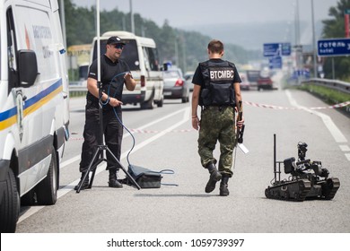 KIEV REGION, UKRAINE - July 26, 2016: Robot Of Explosive Technical Service Of National Police Of Ukraine Inspect The Road After An Anonymous Report On Mining Of A Public Transport Stop In Kiev Region.