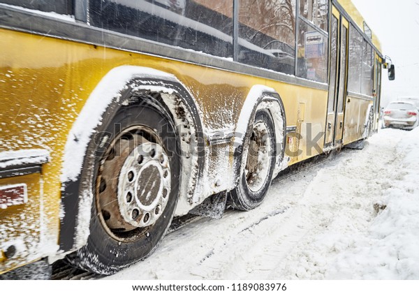 Kiev,\
Ukraine 03/01/2018 A snowstorm in the city took roads, bus on a\
snow-covered road, snowfall is a problem\
element.