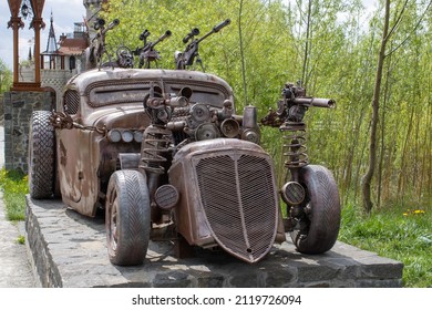 Kiev, Ukraine - 05.15.2021: Victoria Film. Sculpture Car From The Motion Picture Mad Max. Iron Fantastic Transport With Weapon On Board Made From Auto Parts. Art Object Elements From Scrap Metal.