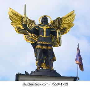 KIEV UKRAINE 09 03 17:  Gold plated bronze statue of Archangel Michael Saint patron of Kiev in independence square (Maydan Nezalezhnosti)