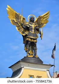 KIEV UKRAINE 09 03 17:  Gold plated bronze statue of Archangel Michael Saint patron of Kiev in independence square (Maydan Nezalezhnosti)