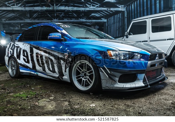 Kiev, Ukraine - 14 May 2014:
Mitsubishi Lancer Evolution X tuning sport-car. It colored in blue,
gray, whites colors with patterns and prints. Editorial
photo.
