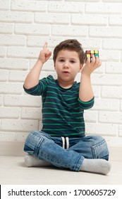 Kiev, Ukraine, 22 march 2020. boy plays with rubik's cube. Rubik's Cube invented by a Hungarian architect Erno Rubik in 1974.