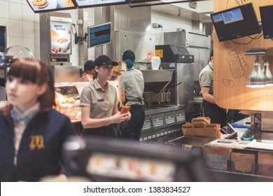 Kiev, Ukraine- April 10, 0219: A McDonald's Employee Is Doing His Job.