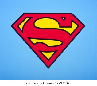 KIEV, UKRAINE - APRIL 16, 2015:  The superhero comic figure Superman sign logo printed printed on paper and placed on white background. Superman-Superhero comics, which are produced by DC Comics.