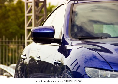 Kiev, Ukraine - April 21, 2020: A Luxury Maserati Levante. Rearview Mirror. Part Of A Blue Car