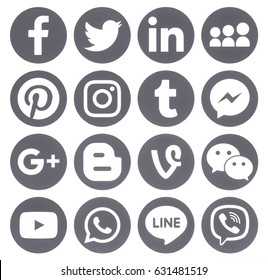 Kiev, Ukraine - April 27, 2017: Collection of popular grey round social media icons, printed on paper: Facebook, Twitter, Google Plus, Instagram, Pinterest, LinkedIn, Blogger, Tumblr and others.