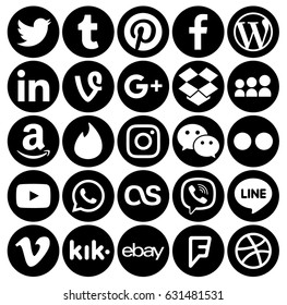Kiev, Ukraine - April 27, 2017: Collection of popular black round social media icons, printed on paper: Facebook, Twitter, Google Plus, Instagram, Pinterest, LinkedIn, Tumblr and others.