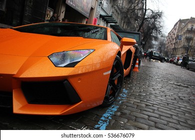 Kiev, Ukraine - April 8, 2012: Lamborghini Aventador on the street. Orange supercar
