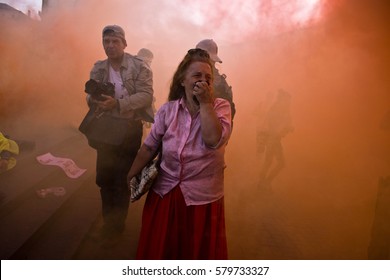 KIEV, UKRAINE - AUGUST 08, 2014: protests in Kiev. Woman in smoke