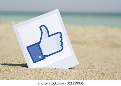 KIEV, UKRAINE - AUGUST 10, 2015: Facebook Like Logo For E-business, Web Sites, Mobile Applications, Banners, Printed On Paper And Placed In The Sand Against The Sea Social Network Facebook Sign.