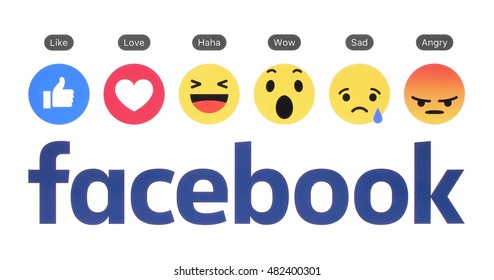 Kiev, Ukraine - August 23, 2016: New Facebook logo with like button and Empathetic Emoji Reactions printed on white paper. 