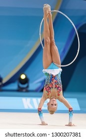 KIEV, UKRAINE - AUGUST 28, 2013: Yana Kudryavtseva, Russia performs with hoop during 32nd Rhythmic Gymnastics World Championships. Eventually she won silver medal