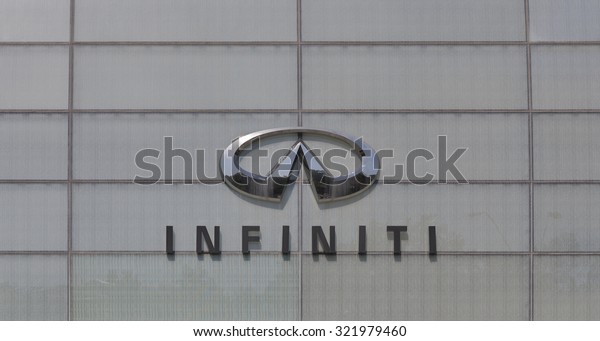 KIEV, UKRAINE - AUGUST 31, 2015: Infiniti\
logo on facade of official dealer auto trade salon Auto-Activ.\
Biggest in Europe, founded 2007 according to the Infiniti Retail\
Environment Design\
Initiative.