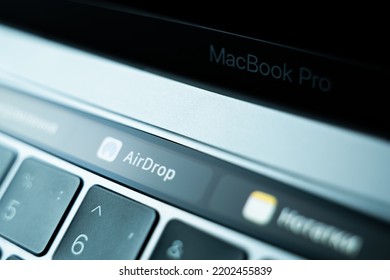 Kiev, Ukraine - August 9, 2022: Wireless File Transfer Method Airdrop On Touch Bar Apple Macbook Pro Closeup