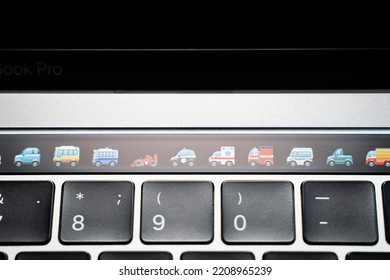 Kiev, Ukraine - August 9, 2022: Emoji Of Different Modes Of Transport On Touch Bar Apple Macbook Pro Closeup