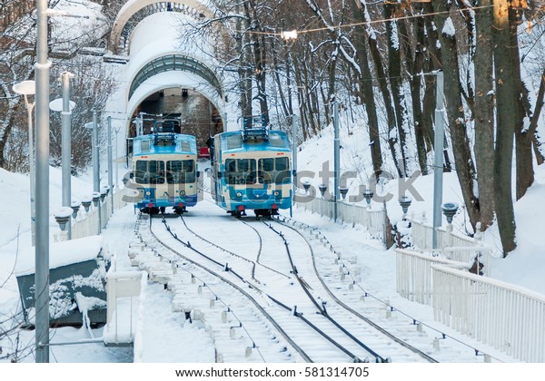KIEV, UKRAINE - DECEMBER 03, 2016:\
Winter Kiev funicular wagon pulls into the bottom\
station
