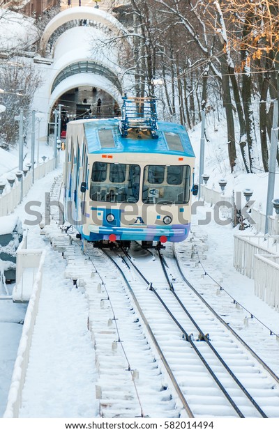 KIEV, UKRAINE - DECEMBER 03, 2016:\
Winter Kiev funicular wagon pulls into the bottom\
station