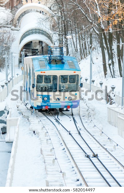 KIEV, UKRAINE - DECEMBER 03, 2016:
Winter Kiev funicular wagon pulls into the bottom
station