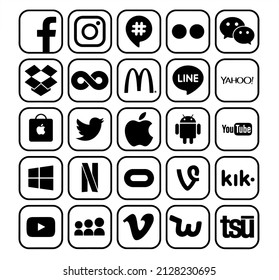 Kiev, Ukraine - February 08, 2022: Set of popular social media and other black icons with rim: Facebook, Twitter, Instagram, Wechat, Line, Youtube and others, printer on paper.