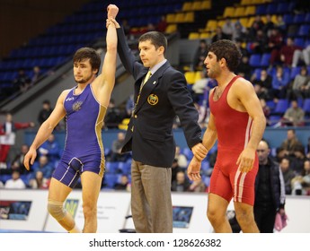 KIEV, UKRAINE - FEBRUARY 16: Mashezov, Russia Win The Match With Jaburian, Armenia During XIX International Freestyle Wrestling And Female Wrestling Tournament In Kiev, Ukraine On February 16, 2013