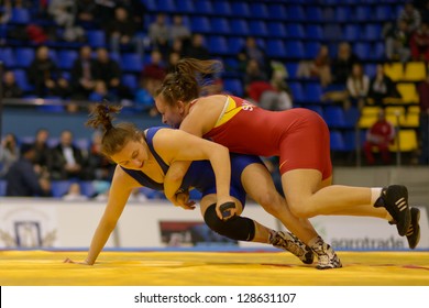 KIEV, UKRAINE - FEBRUARY 16: Match Between Synyshyn, Ukraine, Red And Husiak, Ukraine During XIX International Freestyle Wrestling And Female Wrestling Tournament In Kiev, Ukraine On February 16, 2013