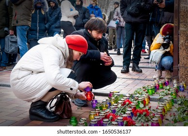 Kiev, Ukraine, February 17, 2020. A Woman Lays Flowers And Lights Candles In Front Of The Embassy Of The Republic Of Iran In Ukraine In Memory Of Those Killed In A Plane Crash Near Tehran. 01/08/2020