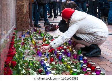 Kiev, Ukraine, February 17, 2020. A Woman Lays Flowers And Lights Candles In Front Of The Embassy Of The Republic Of Iran In Ukraine In Memory Of Those Killed In A Plane Crash Near Tehran. 01/08/2020