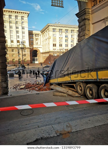 Kiev / Ukraine - February 22 2019: Major accident
in center of Kiev. At intersection of Lutheran and Khreshchatyk
steet Renault Magnum wagon with bricks turned upside down. Two
drivers slept inside