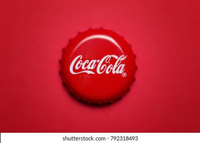 Kiev, UKRAINE - January 12, 2017: classic cap close-up of Coca-Cola on a red background.