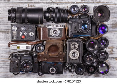 KIEV, UKRAINE - JULY 14. 2017 : illustrative editorial of various vintage photo cameras (35mm film) and old lenses made in USSR, close up