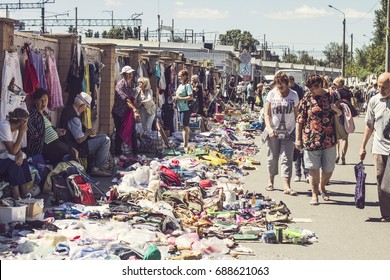 KIEV, UKRAINE - July 2017: People On Flea Market In Kiev. Old Vintage Stuff For Sale. Different Used Products: Books, Electronics, Utensils For Sale On Secondhand Market In Kiev, Ukraine