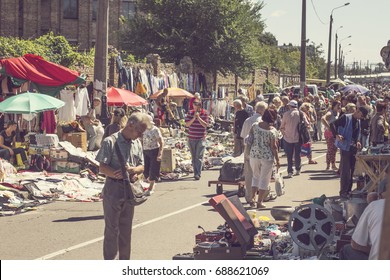 KIEV, UKRAINE - July 2017: People On Flea Market In Kiev. Old Vintage Stuff For Sale. Different Used Products: Books, Electronics, Utensils For Sale On Secondhand Market In Kiev, Ukraine