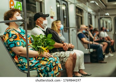 KIEV, UKRAINE - June 09. 2020. The Work Of The Kiev Metro During The Epidemic Of Coronavirus. Passengers In Protective Medical Masks.