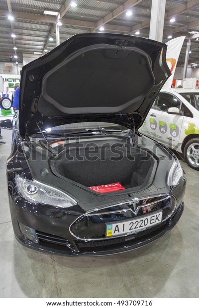 KIEV, UKRAINE - JUNE 10, 2016: Auto City car\
trade company booth with Tesla electric car on display at 1st\
International Trade Show of Electric Vehicles Plug-In in\
KyivExpoPlaza Exhibition\
Center.