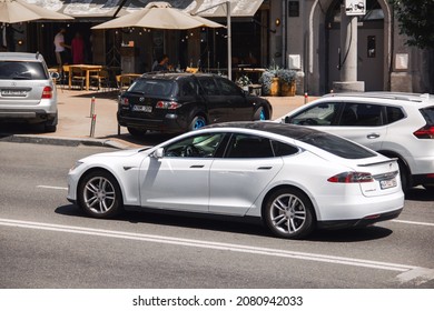 Kiev, Ukraine - June 12, 2021: White Tesla Model S in the city