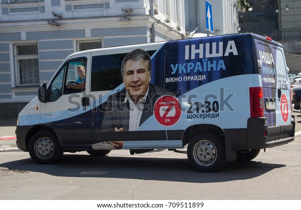 Kiev, Ukraine - June 21,\
2017: Car of the TV channel ZIK with the outdoor advertising of the\
TV show of the authorship of the disgraced politician Mikhail\
Saakashvili