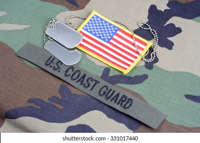 KIEV, UKRAINE - June 6, 2015. US COAST GUARD Branch Tape, Flag Patch And Dog Tags On Woodland Camouflage Uniform