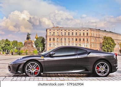 Kiev, Ukraine - June 9, 2013: Ferrari F430 in gray on the background of buildings and monuments