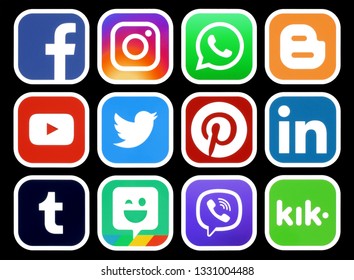 Kiev, Ukraine - March 01, 2019: Popular social media icons with white rim on black background printed on paper: Facebook, Twitter, Instagram, Pinterest, LinkedIn, Viber and others