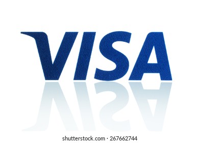 KIEV, UKRAINE - MARCH 21, 2015: Visa logo printed on paper and placed on white background. Visa is an American multinational financial services corporation.