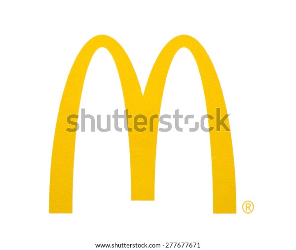 KIEV, UKRAINE - MARCH 31, 2015: McDonal's Logo printed on paper and placed on white background. The McDonald's Corporation is the world's largest chain of hamburger fast food restaurants.