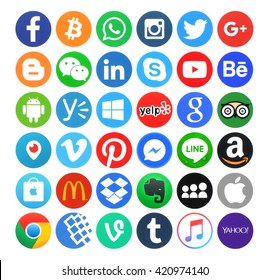 Kiev, Ukraine - May 14, 2016: Collection of popular 36 round icons, printed on paper, of social networking, productivity, food, travel, music, operating system, finance and others