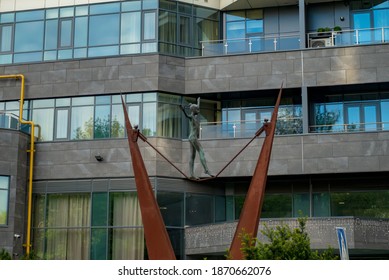KIEV, Ukraine -May 16,2020: The Girl Walks On A Tight Rope. Sculptural Composition
