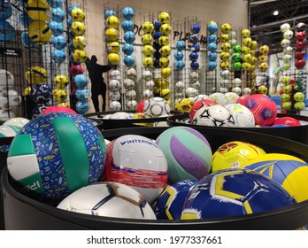 KIEV, UKRAINE - MAY 21, 2021: Basketballs And Soccer Balls On Display In A Sports Warehouse Store.
