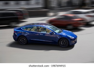 Kiev, Ukraine - May 22, 2021: Tesla Model 3 In Motion. Electric Car On The Road